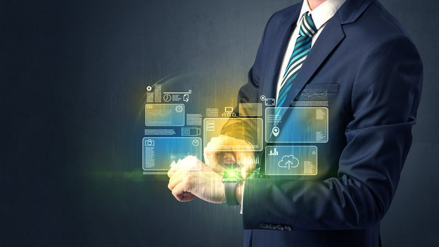 Businessman wearing smartwatch with data symbols and concept. 