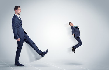 Fototapeta premium Young businessman fired cruel and aggressive by his boss with white background 