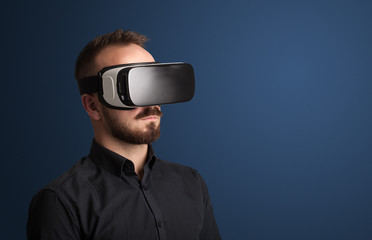 Amazed businessman with virtual reality goggles 