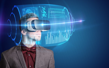 Amazed businessman with high tech 3D projection in front of him 