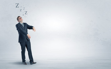 Tired businessman with sleeping sickness going somewhere
