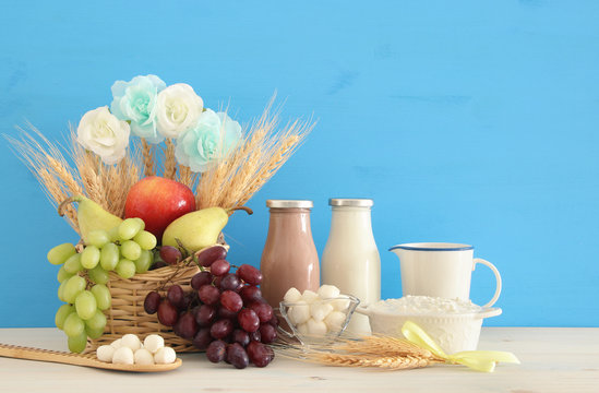 Top view collage image of dairy products and fruits. Symbols of jewish holiday - Shavuot.