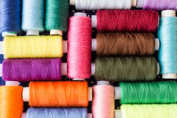 Skeins of multicolored threads for needlework as a background
