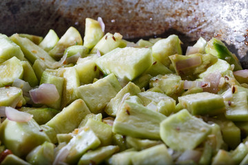 Stirred vegetables in a frying pan