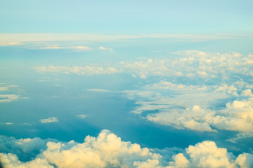 Fluffy sky cloud above view from airplane