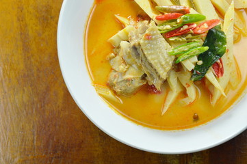 spicy boiled chicken with bamboo shoot in coconut milk curry on bowl