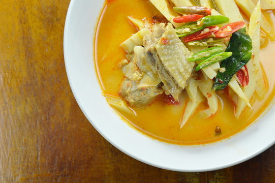 spicy boiled chicken with bamboo shoot in coconut milk curry on bowl