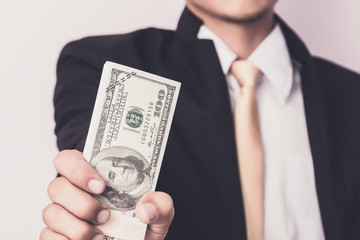 Businessman with money in studio . Business concept