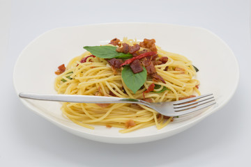 Homemade dry pork spaghetti on white background