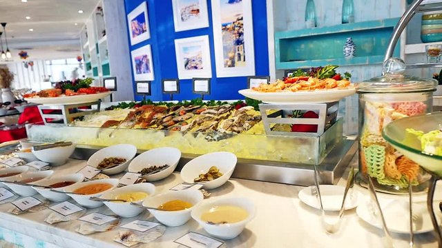 Buffet with fresh dishes at the catered buffet table decorated beautiful. slow motion. 1920x1080, hd