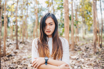 Hipster indy asian women stading in park forest