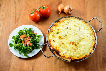 baked quiche with field salad