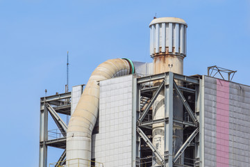 Refinery tower in petrochemical industrial plant with cloudy sky