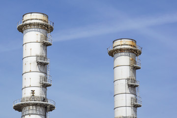 Pipes of industrial factory and blue sky background