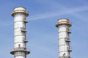 Pipes of industrial factory and blue sky background