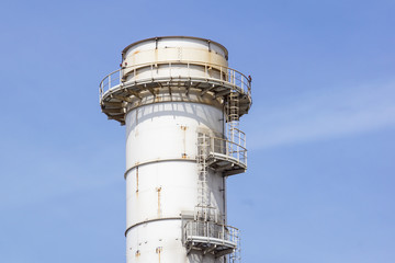 Pipes of industrial factory and blue sky background