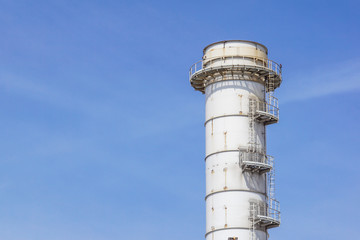 Pipes of industrial factory and blue sky background