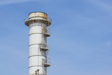 Pipes of industrial factory and blue sky background