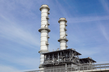 Fototapeta na wymiar Refinery tower in petrochemical industrial plant with cloudy sky