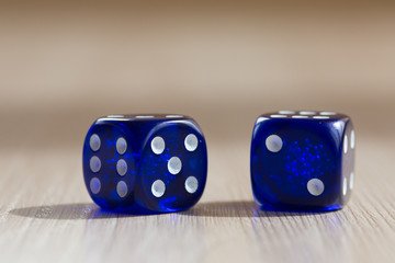 Blue gambling dice on table