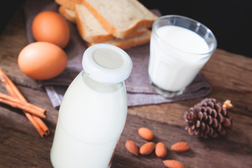 Almond milk bottle and glass, sliced breads and boiled eggs, Healthy food