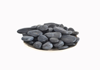 Black massage stones isolated