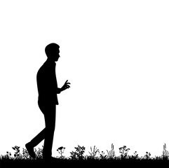 isolated silhouette man walking in the nature