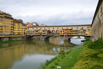 Fototapeta na wymiar View of the Golden Bridge on a cloudy September day. Florence, Italy