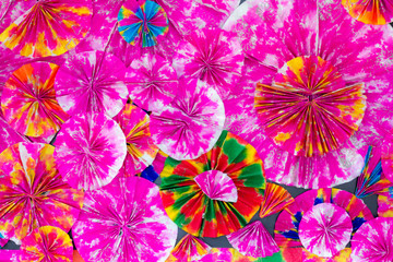 Abstract of colorful paper filigree strips folded in waves., Background color paper folded in...
