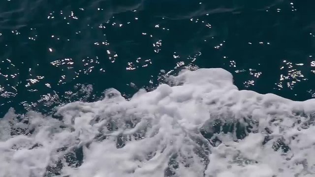 Video sea water and foam outside the ship