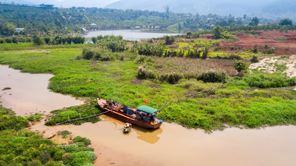 AERIAL 4K: Wooden boat as rural farm and house for everyday life  on the river at North Vietnam