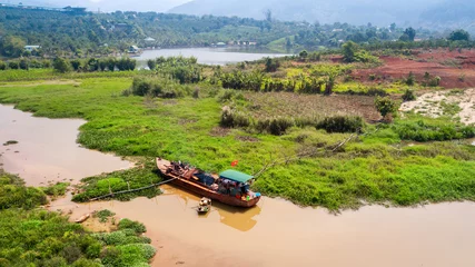 Papier Peint photo autocollant Rivière AERIAL 4K: Wooden boat as rural farm and house for everyday life  on the river at North Vietnam