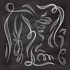 Vector decorative curls and swirls design elements on a chalkboard background