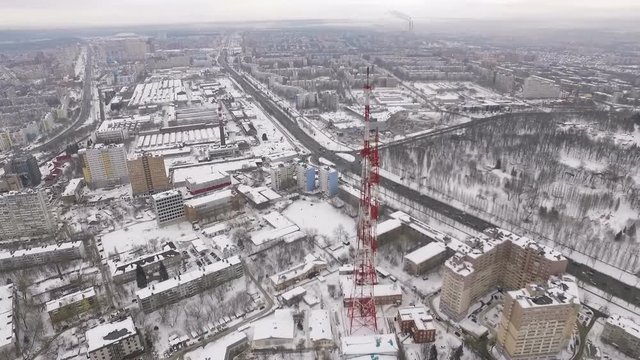 aerial view on modern telecommunication tower, buildings and roads of modern industrial city