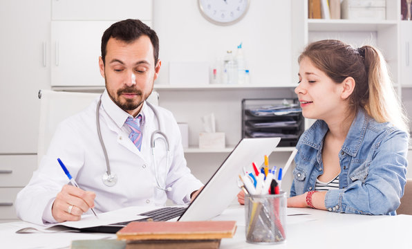 Doctor And Girl With Sore Throat