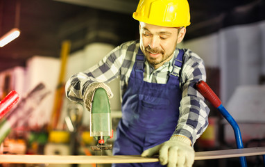 Working man practicing with power jigsaw