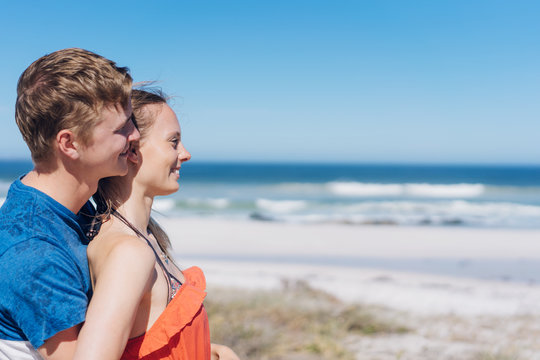 Romantic young couple enjoying a day at a beach
