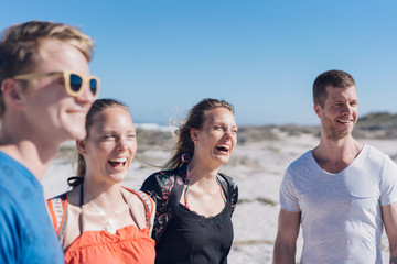 Happy laughing young sisters with their boyfriends