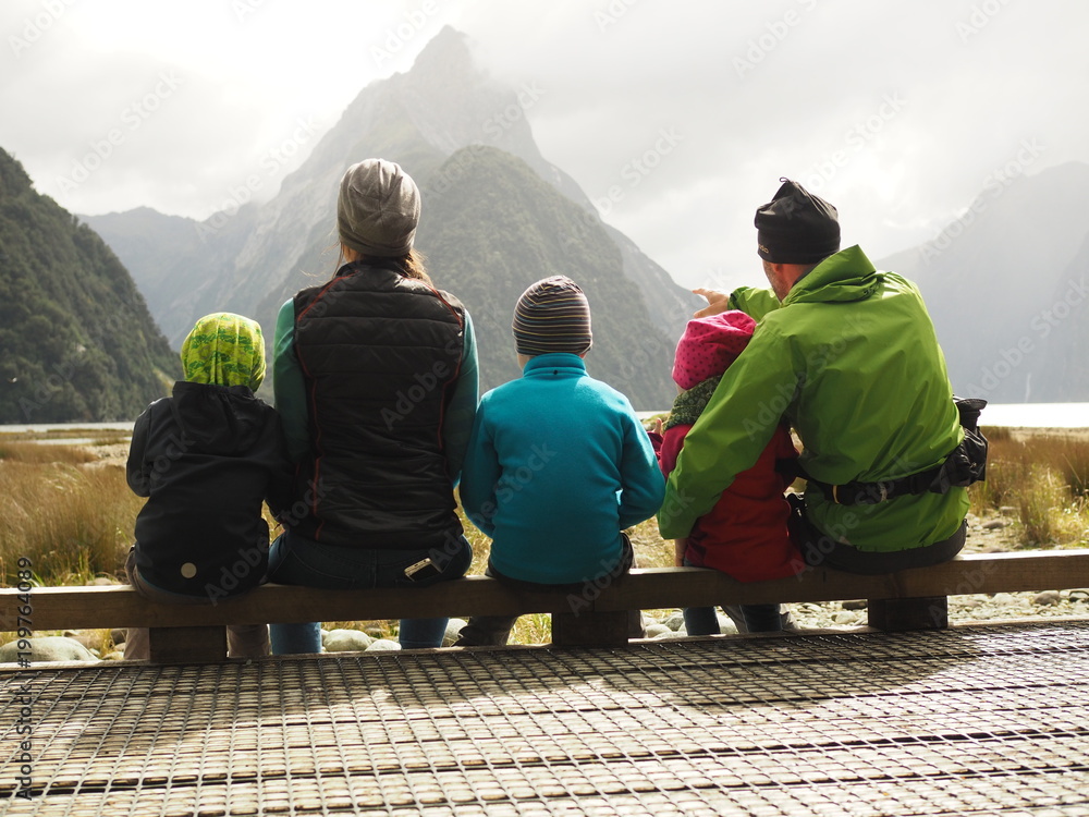 Wall mural family looking at mountains