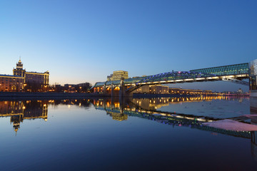 Bright dusk in Moscow, embankment of Moscow river is full of lights and bright colors