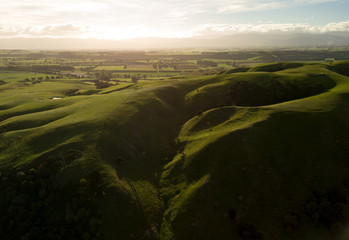 Shadows Cover New Zealand Hills At Sunset In Martinborough 