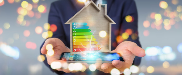 Businessman using 3D rendering energy rating chart in a wooden house