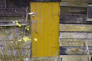old wooden yellow door