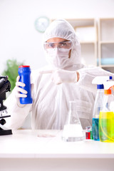 Fototapeta premium Chemist checking the quality of bathroom supplies