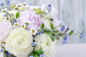 Floral arrangement with pink peonies