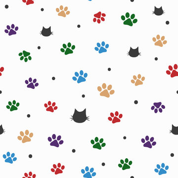 Repeated cat heads, colorful paw prints and round dots. Cute seamless pattern.