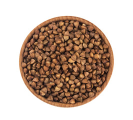 Buckwheat in wooden bowl isolated on white background. Top view