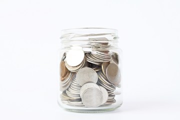Business, finance, saving money or investment concept : Coins in glass jar on white background