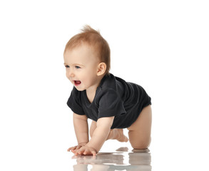 9 month infant child baby  girl toddler crawling in dark grey shirt isolated 