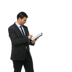 handsome businessman in suit with tablet